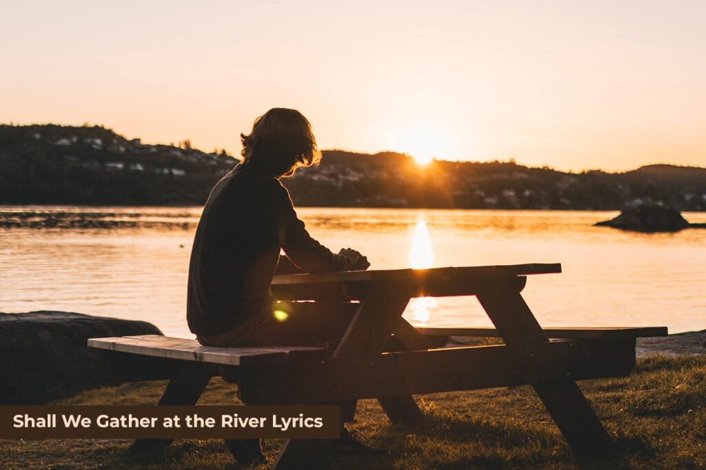 Persons Sitting on Picnic Table - Shall We Gather at the River Lyrics